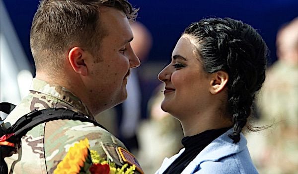 A National Guardsman embraces a loved one at Roland R. Wright Air National Guard Base, Salt Lake City, Nov. 4, 2021, after returning from deployment. (U.S. Air Force photo by Master Sgt. John Winn, National Guard)